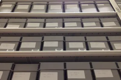 Archived items in boxes in shelving
