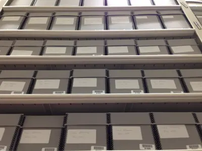 Archived items in boxes in shelving