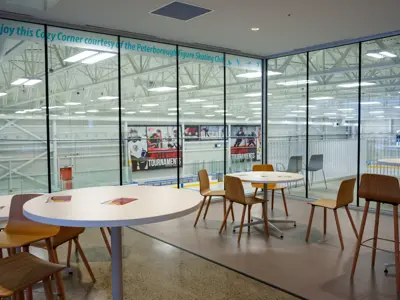 Chairs and tables overlooking an ice pad