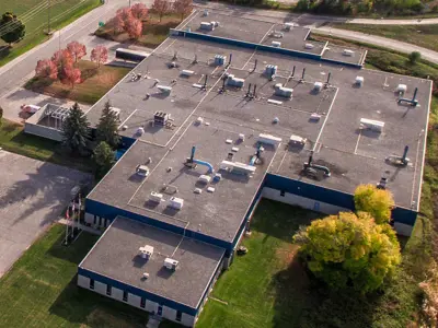 Aerial photo of a commercial building, roads and landscaping