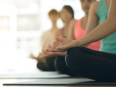 People doing yoga indoors