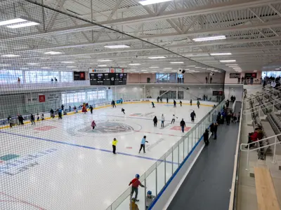 People skating indoors at Miskin Law Community Complex