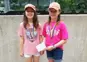 two girls posing with medals
