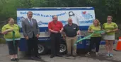 water wagon ribbon cutting with the MP and committee