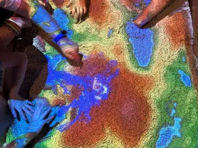 Kids hands in Augmented Reality Sandbox 