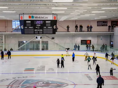 Ice pad at Miskin Law Community Complex with people skating