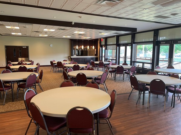 McDonnel Street Community Centre open room space with many tables and chairs to give perspective of the space available