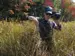 research in the field with detection equipment surrounded by long grass